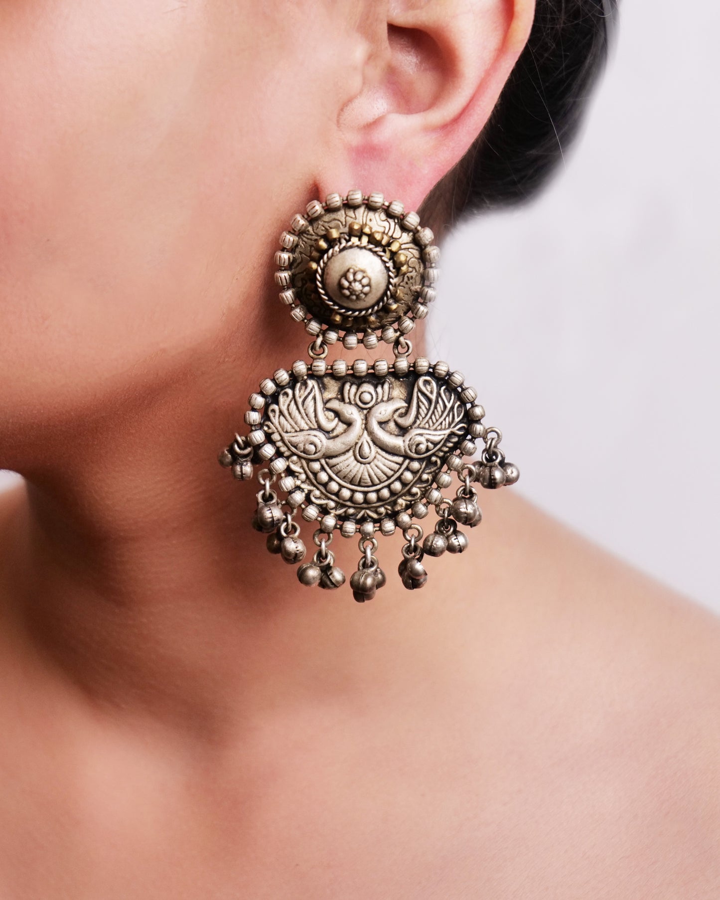 Silver tone tribal earrings