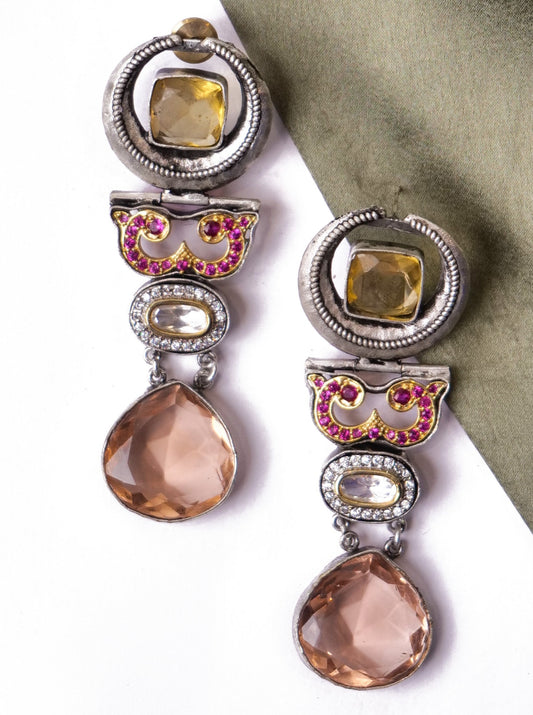 Statement earrings in peach and pink stones