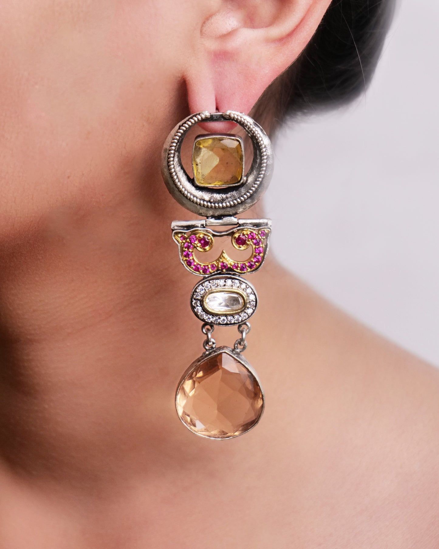 Statement earrings in peach and pink stones